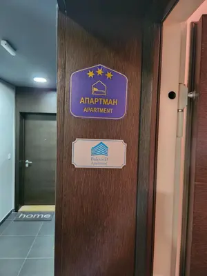 a door with a sign on it in a building at BulevarD Apartment in Belgrade