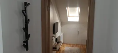 a hallway with a skylight and a door to a room at Apartman Blagojevic Hill in Arandjelovac