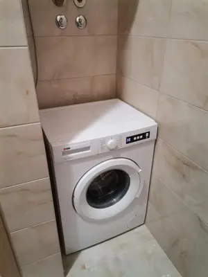 a washer and dryer in a small room at Apartman Blagojevic Hill in Arandjelovac