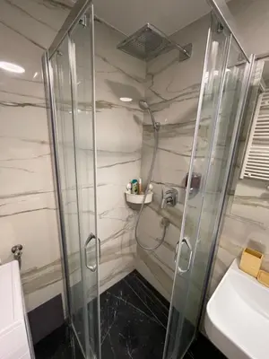 a bathroom with a shower and a sink at Princess - free parking place in the garage in Belgrade