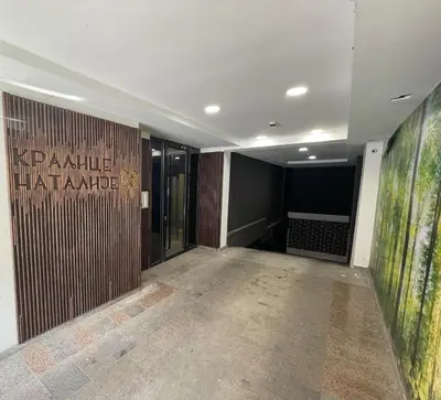 an empty hallway with a large painting on the wall at Princess - free parking place in the garage in Belgrade