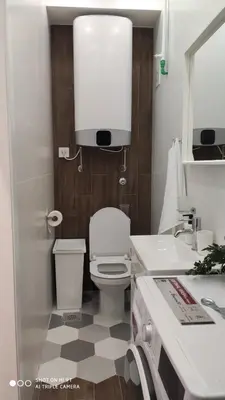 a bathroom with a toilet and a sink and a mirror at Zone Vidikovac in Belgrade