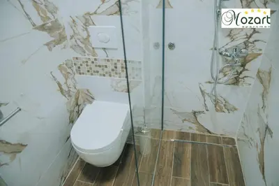 a bathroom with a toilet and a shower at Mozart-Apartman in Arandjelovac