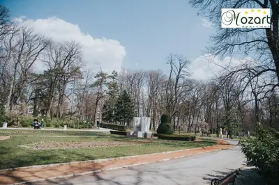 a cemetery with a christmas tree in a park at Mozart-Apartman in Arandjelovac