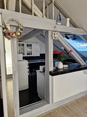 a kitchen with a counter in the middle of a house at Deki & Kolet in Belgrade