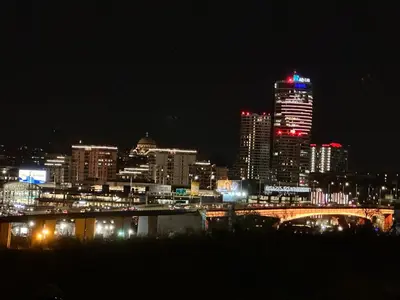 a city skyline at night with a bridge and buildings at Blok in Sajmište