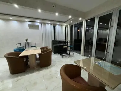 a dining room with a glass table and chairs at Motel Gas in Belgrade