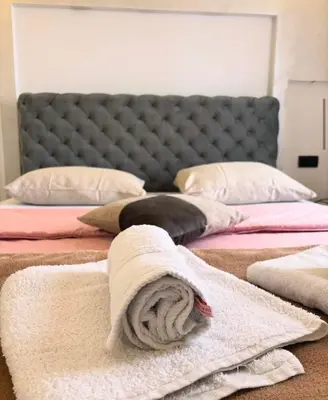a bedroom with two beds with towels on them at Motel Gas in Belgrade