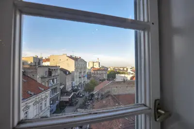 a view of a city from a window at Heart of Belgrade Skadarlija Apartment in Belgrade