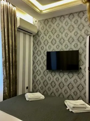a room with a tv on a wall at Vinceia in Smederevo