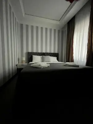 a bedroom with a large bed and a window at Vinceia in Smederevo