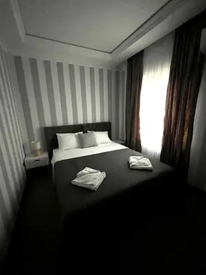a bedroom with a bed with two towels on it at Vinceia in Smederevo