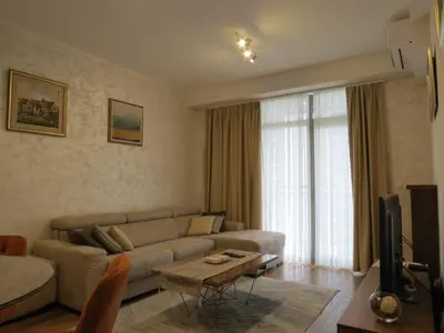 a living room with a couch and a tv at Premium NB Apartment - Belgrade Waterfront in Belgrade