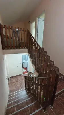 a wooden staircase in a house with a room at Vila Marina in Kovin