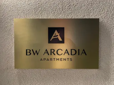 a sign on a wall with a bvm aracciaarma departments at AparTwentyOne - Your Home in Belgrade in Belgrade