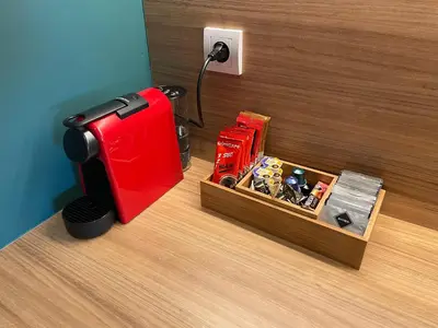a red suitcase next to a box of toys at AparTwentyOne - Your Home in Belgrade in Belgrade