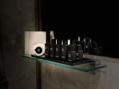 a shelf with a row of black batteries on it at AparTwentyOne - Your Home in Belgrade in Belgrade