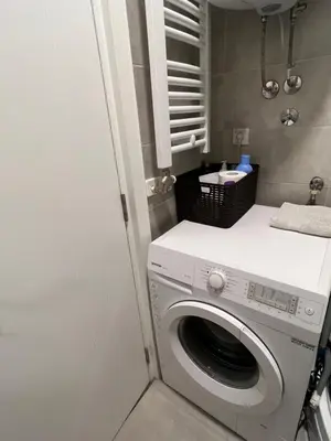 a washer and dryer in a small bathroom at Delete 4 in Novi Grad