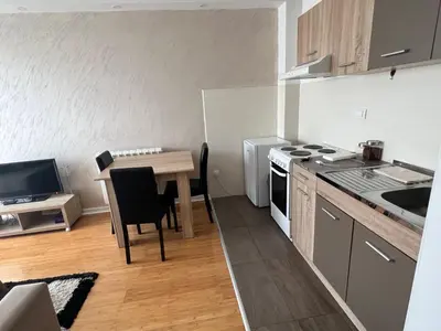 a small kitchen with a table and a stove at Delete 4 in Novi Grad