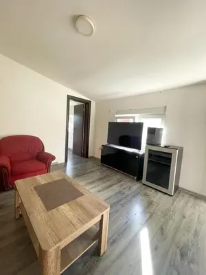 a living room with a coffee table and a piano at Vracar Apartment in Belgrade
