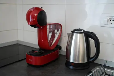 a red blender sitting on top of a kitchen counter at Quiet Luxury Family Apt Belgrade Fortress Center in Belgrade