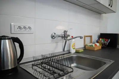 a kitchen sink with a dish drying rack on it at Quiet Luxury Family Apt Belgrade Fortress Center in Belgrade