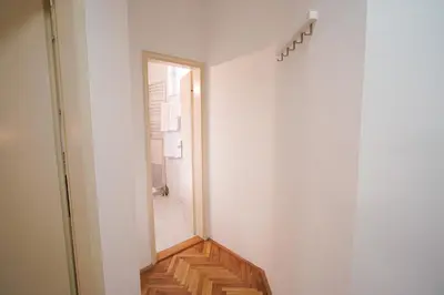 a hallway with a stairway leading to a room at Quiet Luxury Family Apt Belgrade Fortress Center in Belgrade