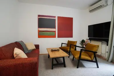 a living room with a couch and a table at Quiet Luxury Family Apt Belgrade Fortress Center in Belgrade