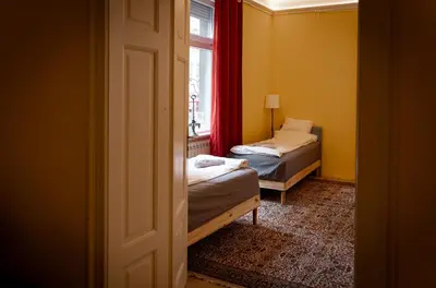 a room with two beds and a window at BGLAB Salon Apartment in Belgrade