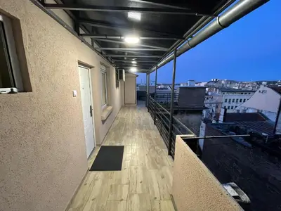 a balcony of a building with a view of a city at New Sky Terrace in Belgrade