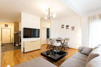 a living room with a couch and a table at President Apartman 8 in Vračar (historical)