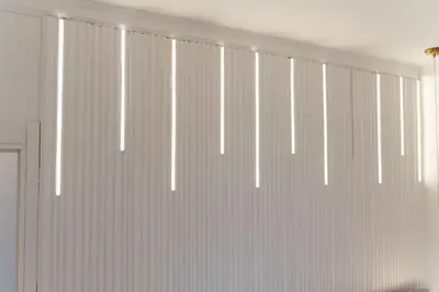 a room with white vertical blinds on a window at President Apartman 8 in Vračar (historical)