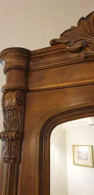 a wooden mirror with a carved wooden frame at VANSVEL Boutique Apartment 8 in Belgrade