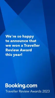 a blue sign that says were so happy to announce that we won a traveler at VANSVEL Boutique Apartment 8 in Belgrade