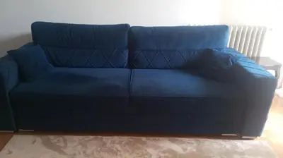 a blue couch sitting in a living room at Apartment MrC , FREE PARKING in Bežanija