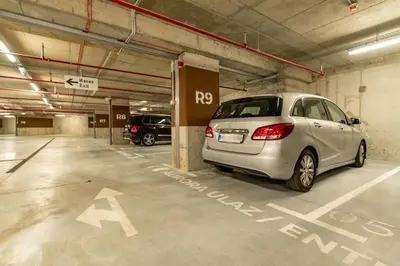 a silver car parked in a parking garage at Belgrade Waterfront Bramar in Belgrade