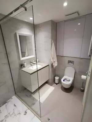 a bathroom with a toilet and a sink and a shower at Beograd na vodi -Belgrade Waterfront BW in Sajmište