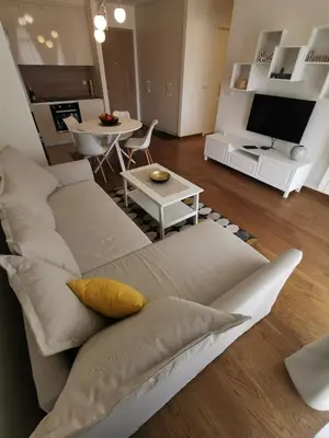 a living room with a couch and a table at Beograd na vodi -Belgrade Waterfront BW in Sajmište