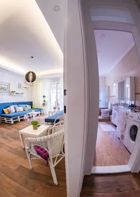 a room with a living room with a surfboard at Hostel Beogradjanka in Belgrade