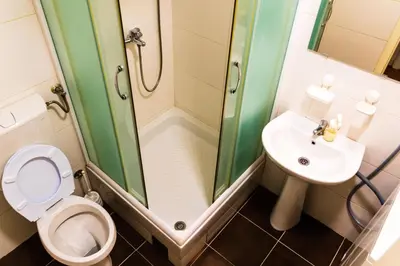a bathroom with a toilet and a sink and a shower at Njegoševa in Belgrade
