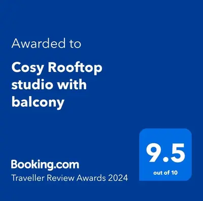 a screenshot of a cell phone with the text awarded to cosy rooftop studio at Cosy Rooftop studio with balcony in Belgrade