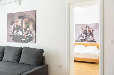 a living room with a couch and a bed at Tim 3 in Belgrade