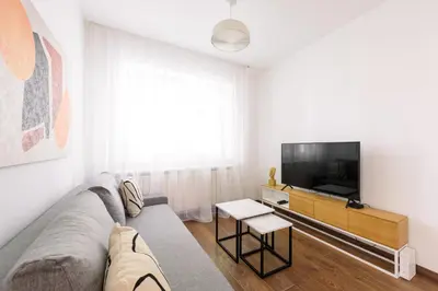 a living room with a couch and a tv at Tim 3 in Belgrade