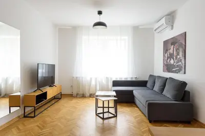 a living room with a couch and a tv at Tim 3 in Belgrade