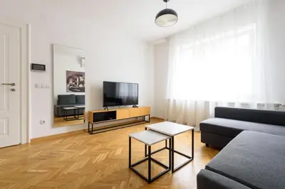 a living room with a couch and a tv at Tim 3 in Belgrade