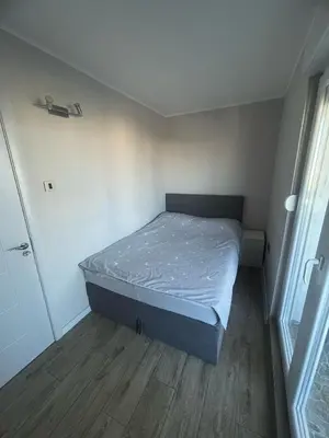 a small bedroom with a bed in a room at Viewpoint in Belgrade