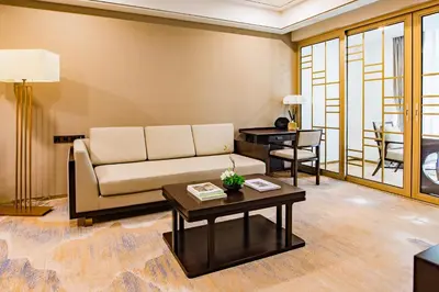 a living room with a couch and a table at LDS Hotel Belgrade in Belgrade