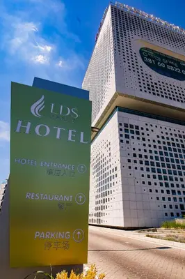 a hotel with a sign in front of a building at LDS Hotel Belgrade in Belgrade