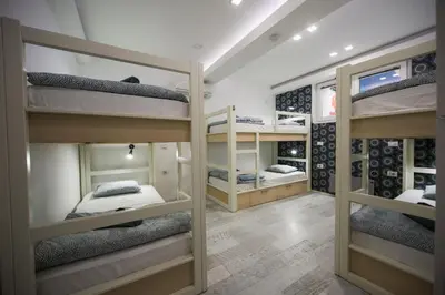 a room with four bunk beds in it at Hostel Bongo in Belgrade