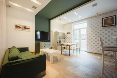 a living room with a couch and a table at Hostel Bongo in Belgrade